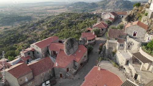 Aerial of iconic medieval Portuguese village of Monsanto on mountainside photo