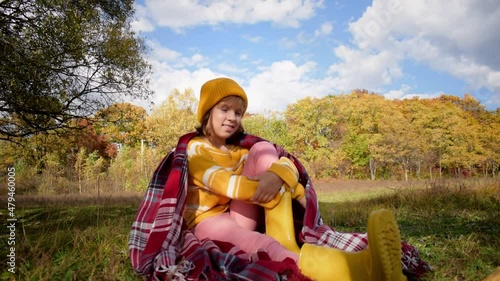 Wallpaper Mural One child girl covered herself with a checkered blanket in the autumn forest. People are one with nature. Health concept. Taking care of health, authenticity, a sense of balance and calmness. Torontodigital.ca