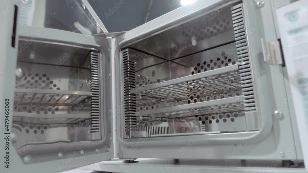 The versatile drying ovens (drying cabinet) are suitable for a variety of applications and areas: industry, science, medicine and pharmaceuticals. Shot in motion. Closeup The versatile drying ovens (drying cabinet) are suitable for a variety of applications and areas: industry, science, medicine and pharmaceuticals. Shot in motion. Closeup