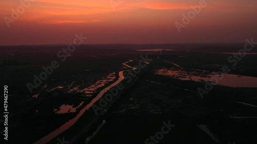 Creek And Fields With Dramatic Sky During Sunset In Vasai, Mumbai, India. - aerial photo