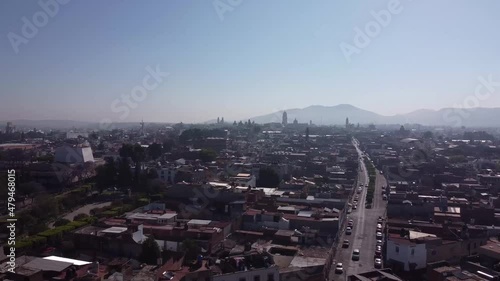 Panoramic aerial view of downtown of Morelia, Michoacan, Mexico. Drone shot with mountains at background