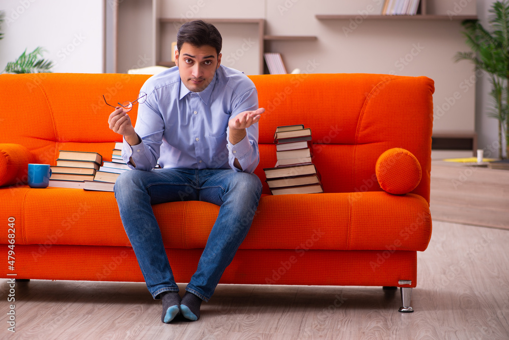 Young male student preparing for exams at home Young male student preparing for exams at home