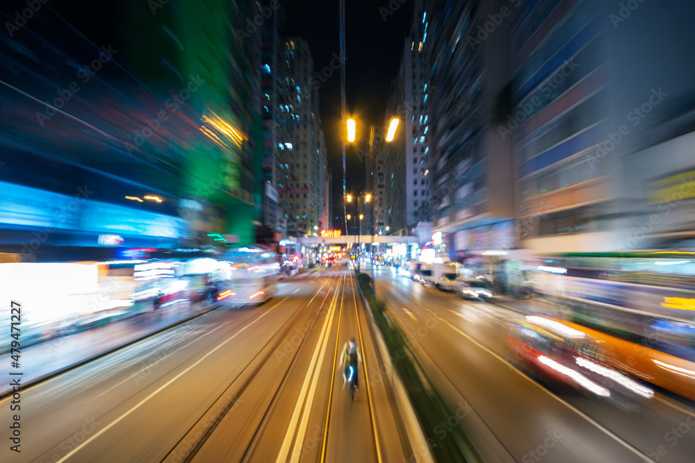 Night scenery of abstract traffic background viewed from speed motion train through downtown district of Hong Kong city