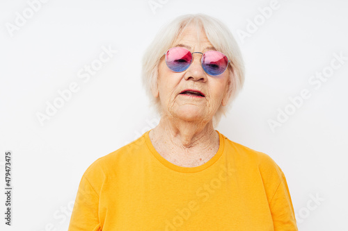 Photo of retired old lady happy lifestyle in yellow t-shirts close-up emotions