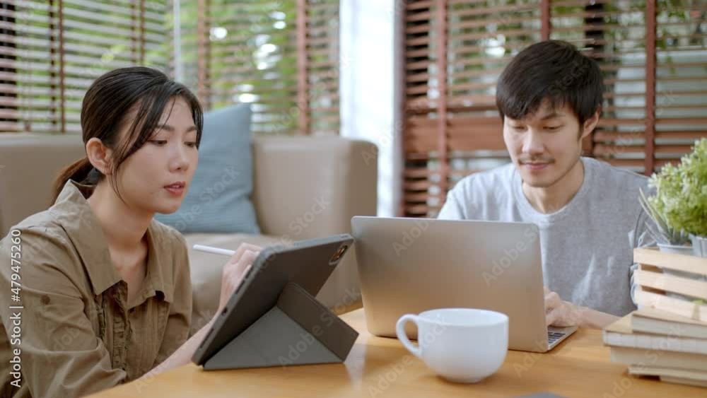 home isolation remote jobs work during coronavirus(delta and omicron) outbreak concept.Young asian couple people entrepreneur working together and online remote conference with laptop at home home isolation remote jobs work during coronavirus(delta and omicron) outbreak concept.Young asian couple people entrepreneur working together and online remote conference with laptop at home