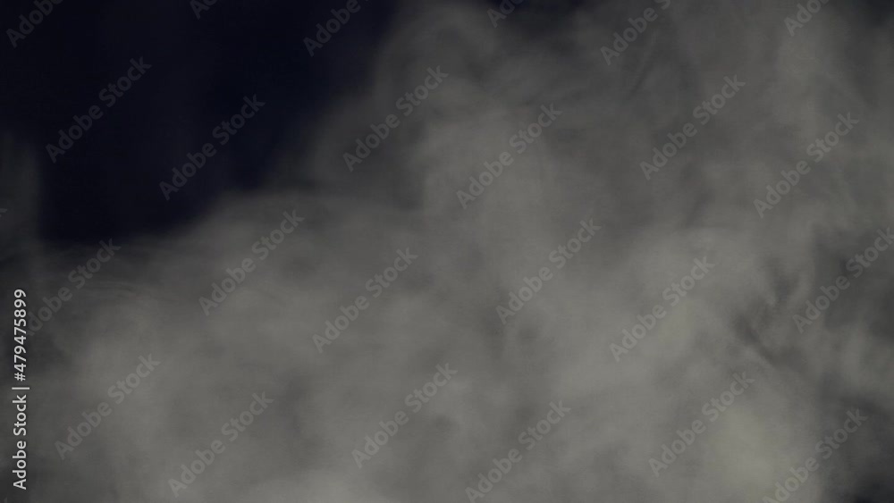 White smoke, fog, steam cloud moving in slow motion isolated on black background White smoke, fog, steam cloud moving in slow motion isolated on black background