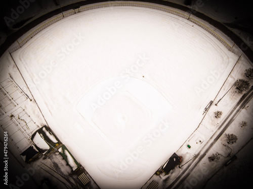 Photography A vintage feel look of an aerial view of a snow covered baseball field in winter