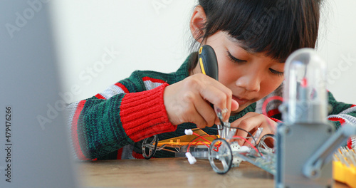 Wallpaper Mural The little girl asian building robotic car in science lesson in the house . Which increases the development and enhances learning skills gifted brilliant children working with technology. Torontodigital.ca