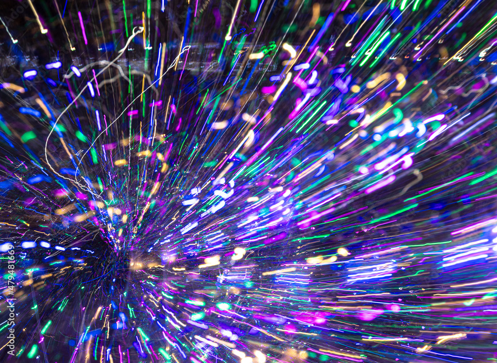 Festive lights in motion as an abstract background. Festive lights in motion as an abstract background.