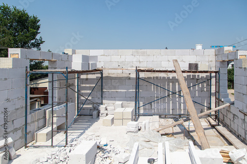 Construction of the walls of the house from foam concrete bricks.