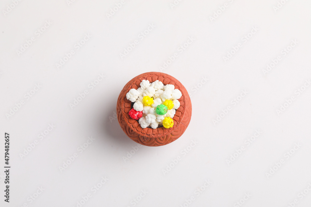 Indian festival makar sankranti concept : Tilgul in small bowl. Tilgul is a colourful sesame candy coated with sesame seeds; in Maharashtra people exchange tilgul on Sankranti Indian festival makar sankranti concept : Tilgul in small bowl. Tilgul is a colourful sesame candy coated with sesame seeds; in Maharashtra people exchange tilgul on Sankranti