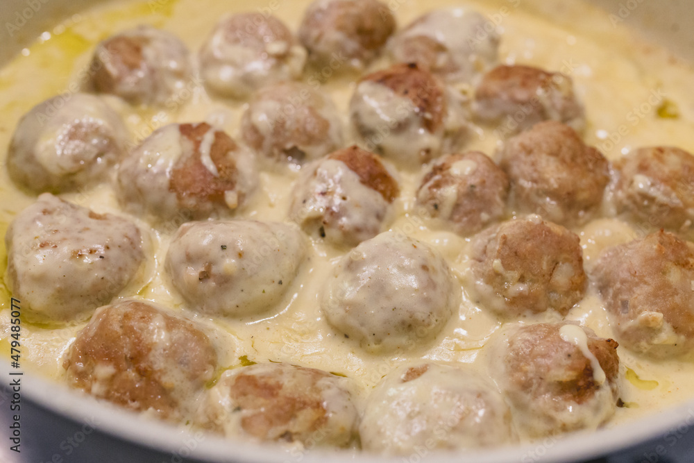Swedish meatballs in a creamy white sauce step by step recipe. Meatballs close up on frying pan Swedish meatballs in a creamy white sauce step by step recipe. Meatballs close up on frying pan