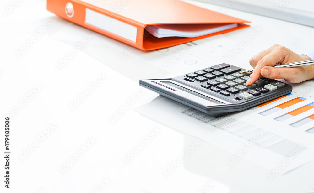 Finance and business concept. Hand pointing at statistics chart. laptop on financial graphs on desk. Female small business. Accounting budgeting loans or market analysis. Business growth Finance and business concept. Hand pointing at statistics chart. laptop on financial graphs on desk. Female small business. Accounting budgeting loans or market analysis. Business growth