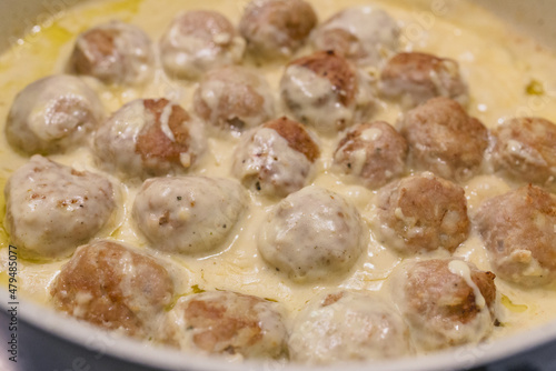 Swedish meatballs in a creamy white sauce step by step recipe. Meatballs close up on frying pan