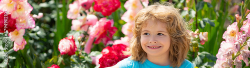 Banner with spring kids portrait. Child watering a plant with watering can.