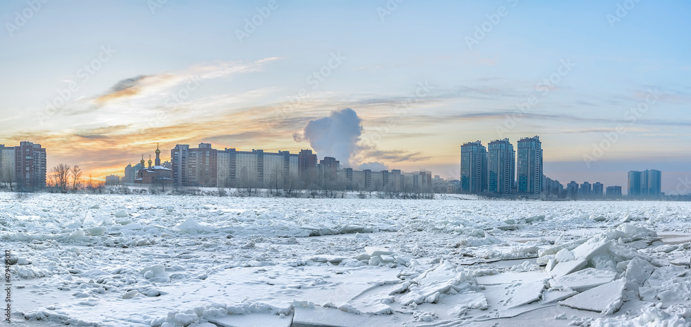 View of residential buildings in the Rybatskoye district of St. Petersburg from the right bank of the Neva River