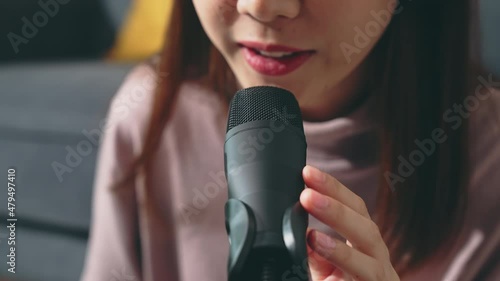 Woman use microphones wear headphones with laptop record podcast. Content creator concept.