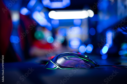Close up view of professional mouse and high performance computer for video games in game room.