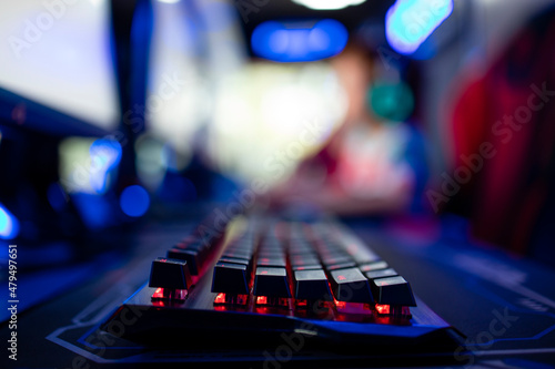 Close up view of keyboard in video game room. Entertaining industry.