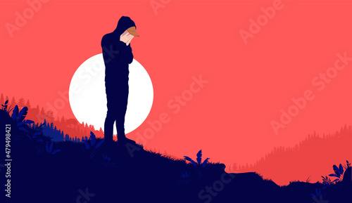 Crying man outdoors - Depressed male person alone in landscape with bright red background and copy space for text