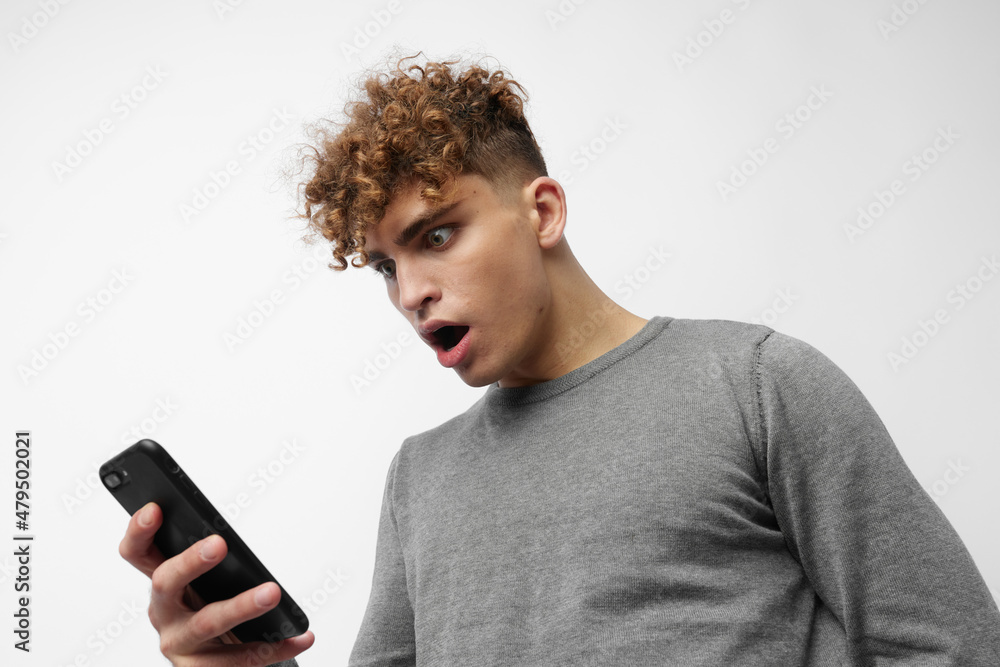 stylish guy talking on the phone posing emotions isolated background