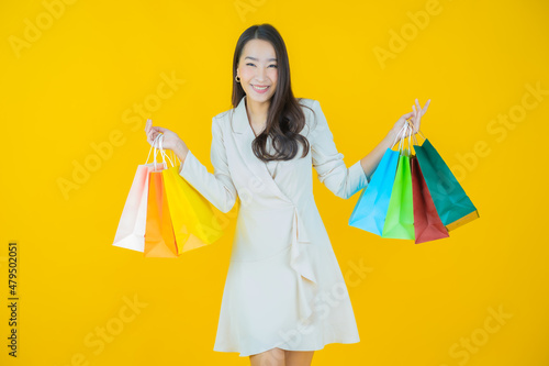 Portrait beautiful young asian woman smile with shopping bag