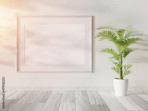 Fototapeta Naklejka Na Ścianę i Meble -  White frame hanging in bright interior mockup. Template of a picture framed on a wall 3D rendering