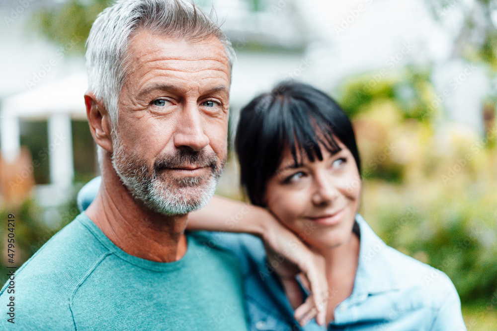 Thoughtful woman with hand on shoulder of man Thoughtful woman with hand on shoulder of man