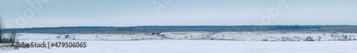 Panorama Winter view of a snow-covered plain or steppe in cloudy weather