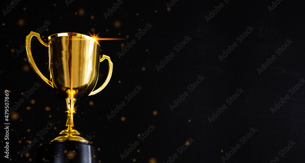 Golden metal glasses on old wooden table background Golden metal glasses on old wooden table background