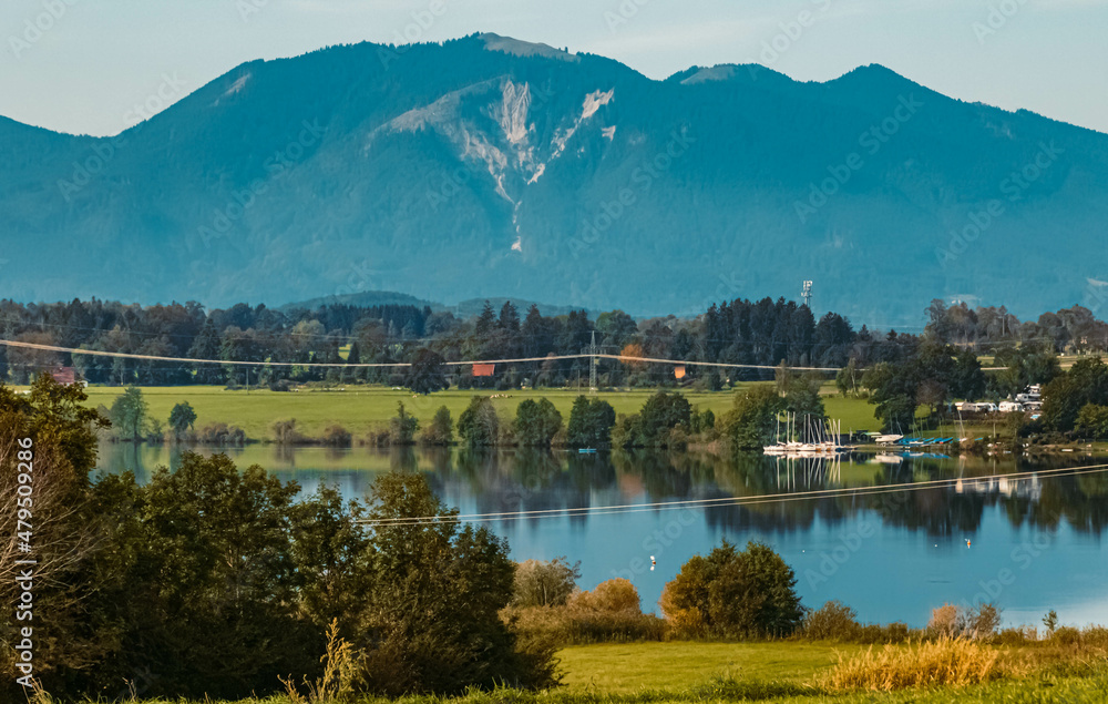 Beautiful alpine summer view with the alps in the background at Aidling near the famous Riegsee lake, Bavaria, Germany Beautiful alpine summer view with the alps in the background at Aidling near the famous Riegsee lake, Bavaria, Germany