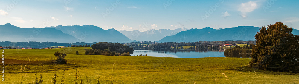 Beautiful alpine summer view with the alps in the background at Aidling near the famous Riegsee lake, Bavaria, Germany