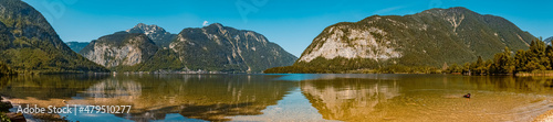 Fototapeta Naklejka Na Ścianę i Meble -  High resolution stitched panorama with reflections at the famous Hallstaetter See lake, Hallstatt, Upper Austria, Austria