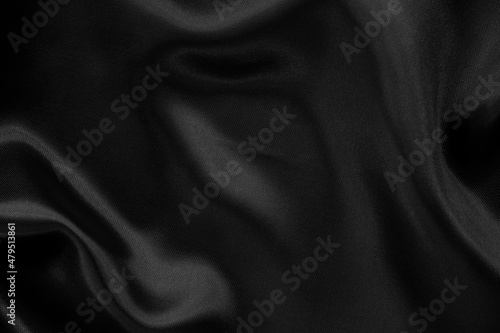 Black grey fabric texture background, detail of silk or linen pattern.