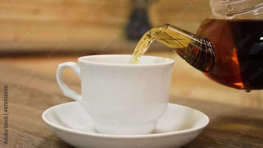 tea is poured into a cup drink breakfast morning cafe table sugar teapot tea is poured into a cup drink breakfast morning cafe table sugar teapot