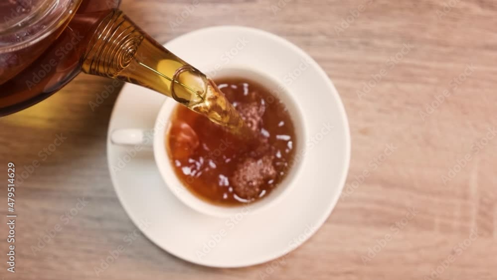 tea is poured into a cup drink breakfast morning cafe table sugar teapot tea is poured into a cup drink breakfast morning cafe table sugar teapot