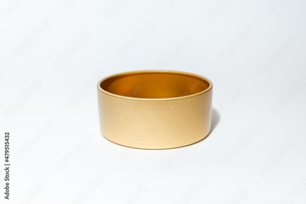 Yellow golden round empty metal box on white background.Soft focus,copy space. Yellow golden round empty metal box on white background.Soft focus,copy space.