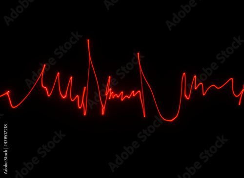 Abstract red lines drawn by light on a black background