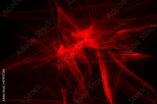 Abstract red lines drawn by light on a black background