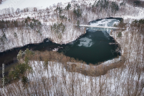 Winter scenery of the railway bridge in Rutki over Radunia river, Kashubia. Poland photo