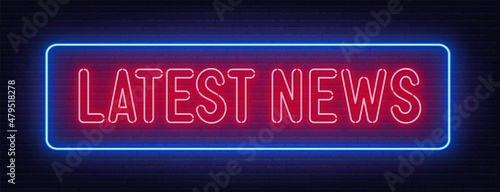 Latest News neon sign on brick wall background