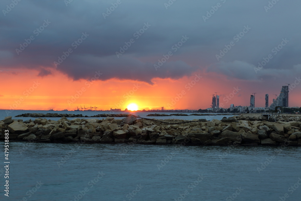 Sunset over the sea, cloudy sky, Limassol in Cyprus