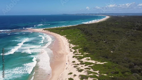 Drone aerial Soldiers Beach bushland and coastline crystal clear beautiful beach reef Pacific Ocean Central Coast NSW Australia 4K photo