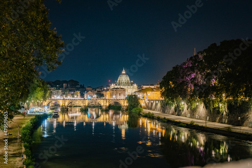 Rome, Italy August, 7th, 2021. Night view of St Angelo bridge and St. Peter's Basilica in the Vatican, Rome, Italy