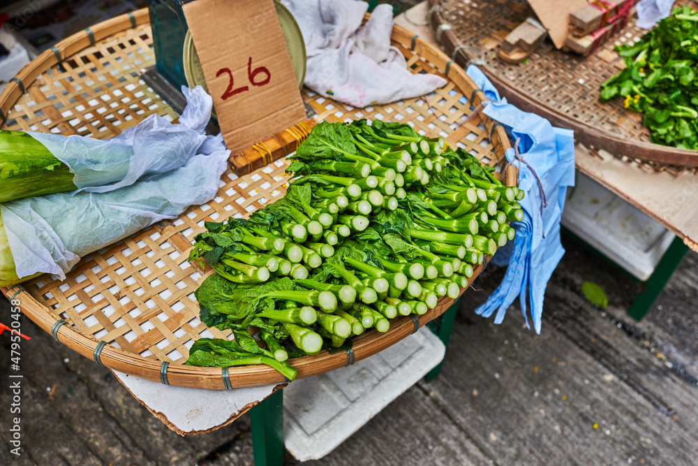 Stall of organic vegetables and fruits at a farmers market. Selling organic fresh agricultural product at farmer market. Bali, Indonesia. Stall of organic vegetables and fruits at a farmers market. Selling organic fresh agricultural product at farmer market. Bali, Indonesia.