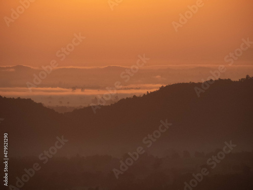 Fototapeta Naklejka Na Ścianę i Meble -  Amazing Sunrise Over Misty Landscape. Scenic View Of Foggy Morning Sky With Rising Sun Above Misty Forest