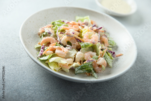 Green salad with shrimps and mayo dressing