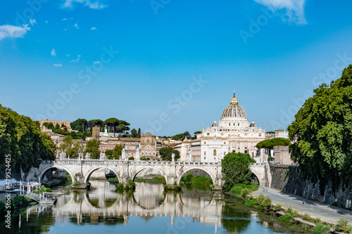 Rome, Italy August, 8th, 2021. View of St Angelo bridge and St. Peter's Basilica in the Vatican, Rome, Italy