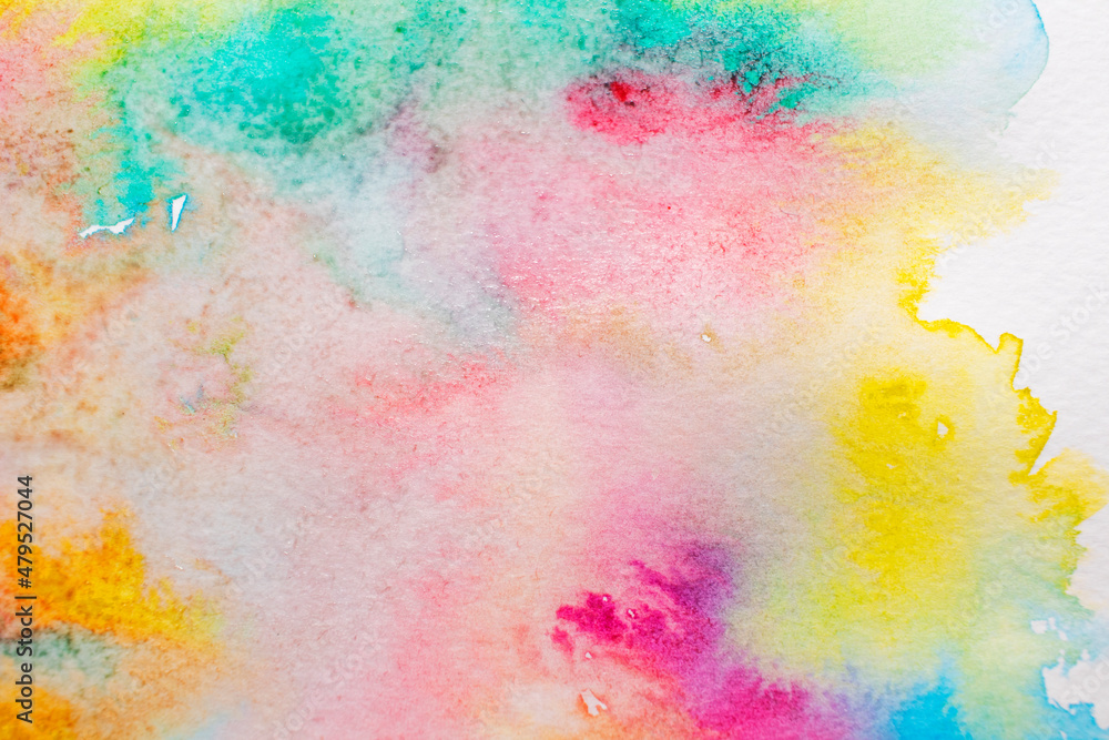Light colorful watercolor stains. Abstract painted background on white paper