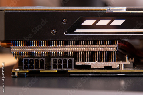 2 ports of 8 pins of power supply of the video card together with a cooling radiator close-up